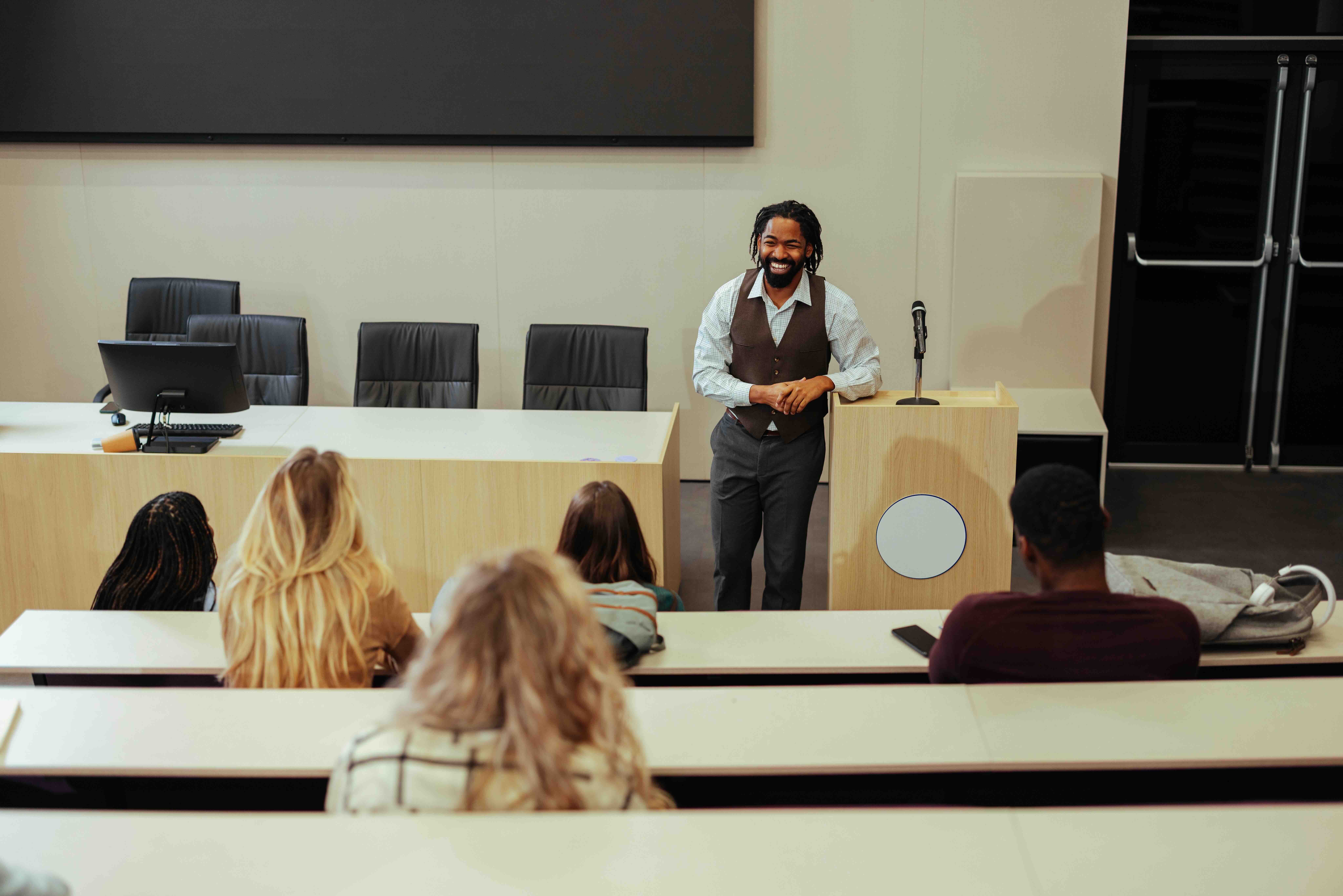 Presenter running a meeting room's audio visual system