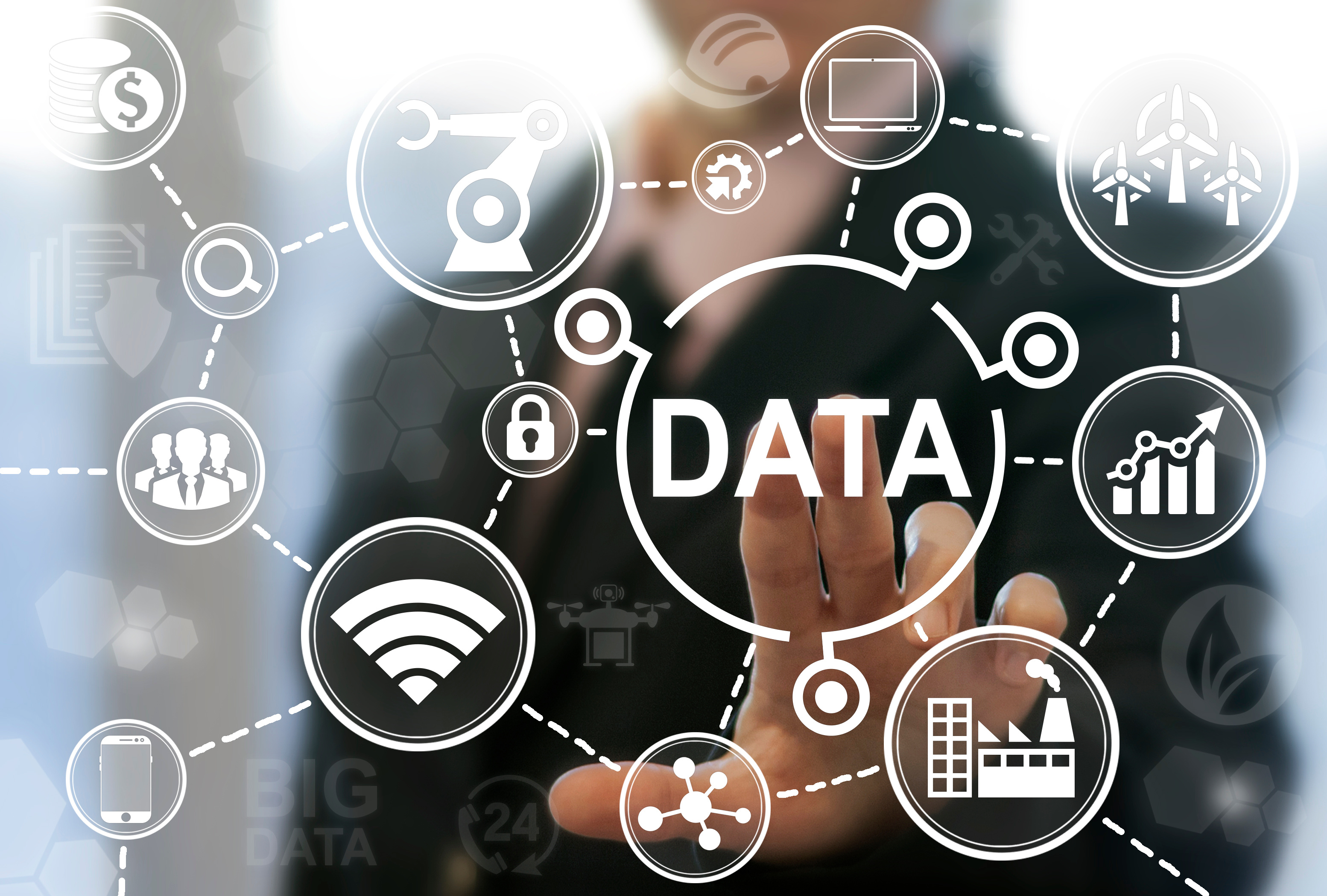 Hand interacting with floating digital icons around the word DATA symbolizing technology and connectivity.