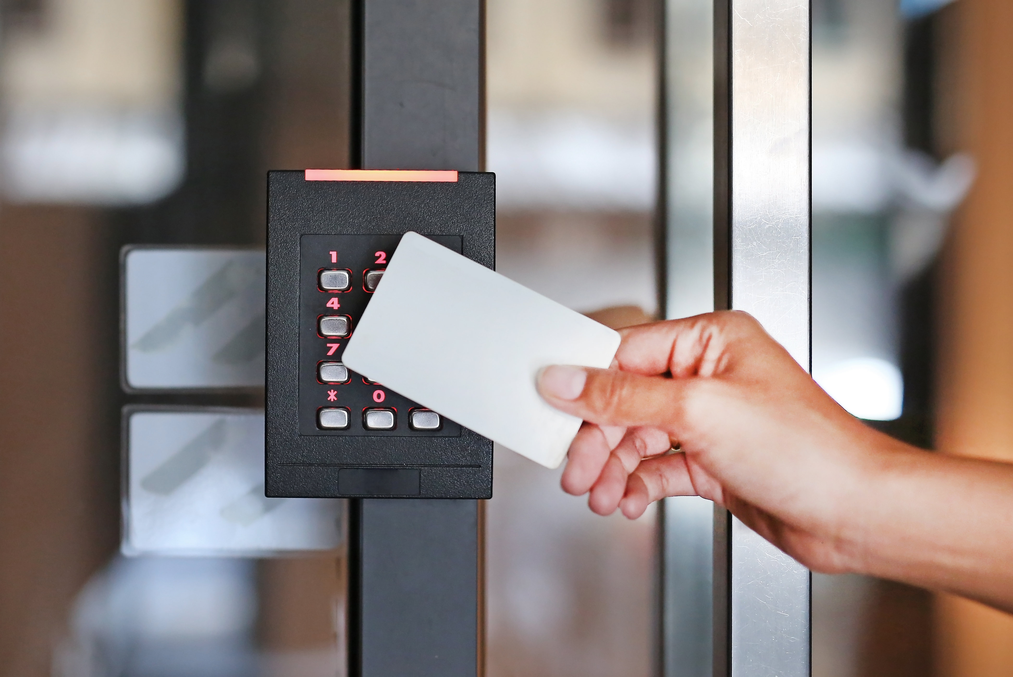 Access control card reader beside a door