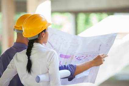 Woman wearing a hard hat on a job site