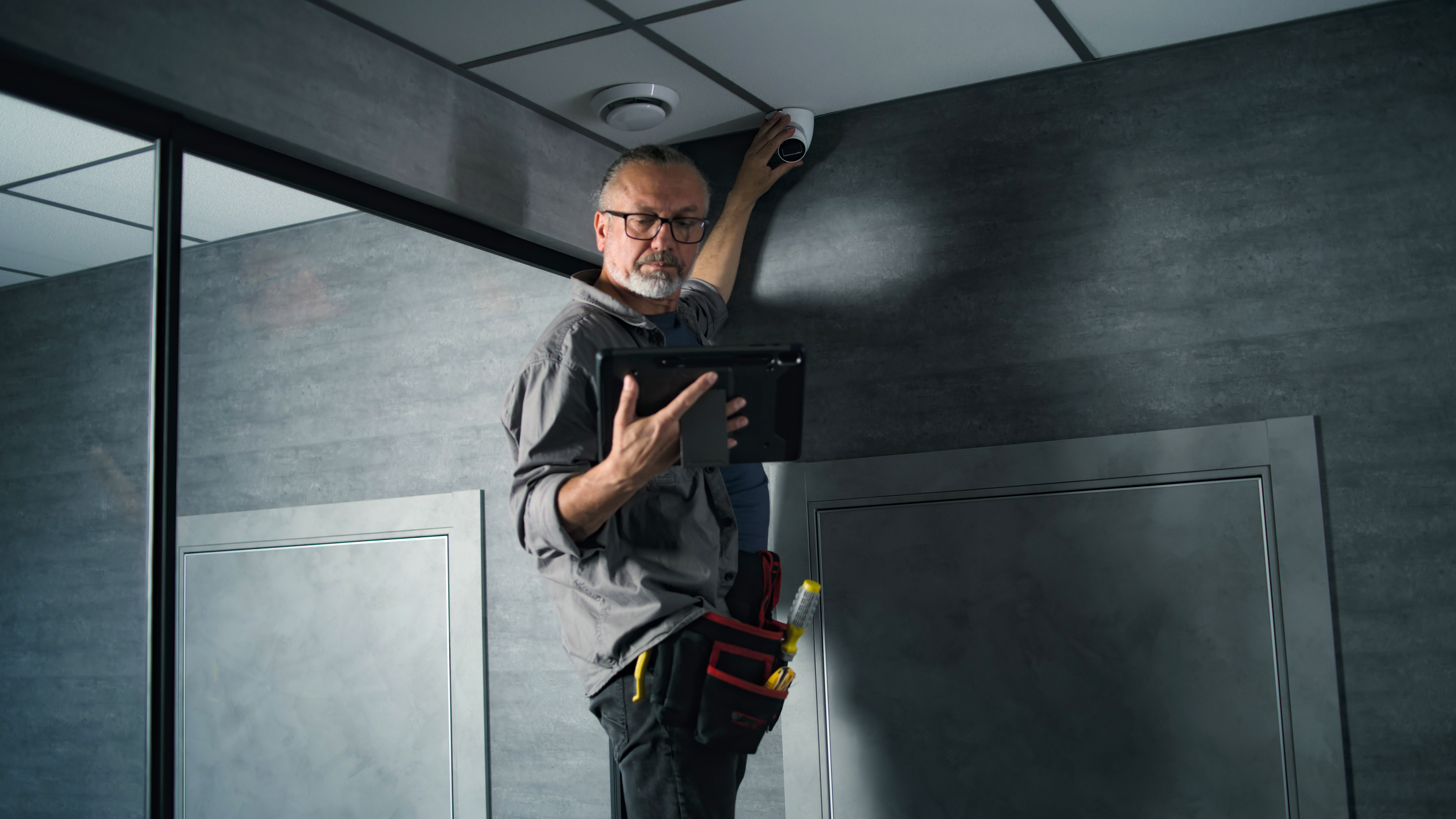 Technicians installing building technology equipment