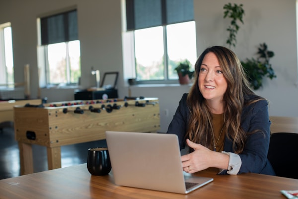 Sales woman working at desk with laptop