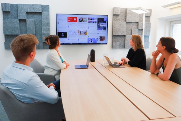 Team having a meeting in front of a screen