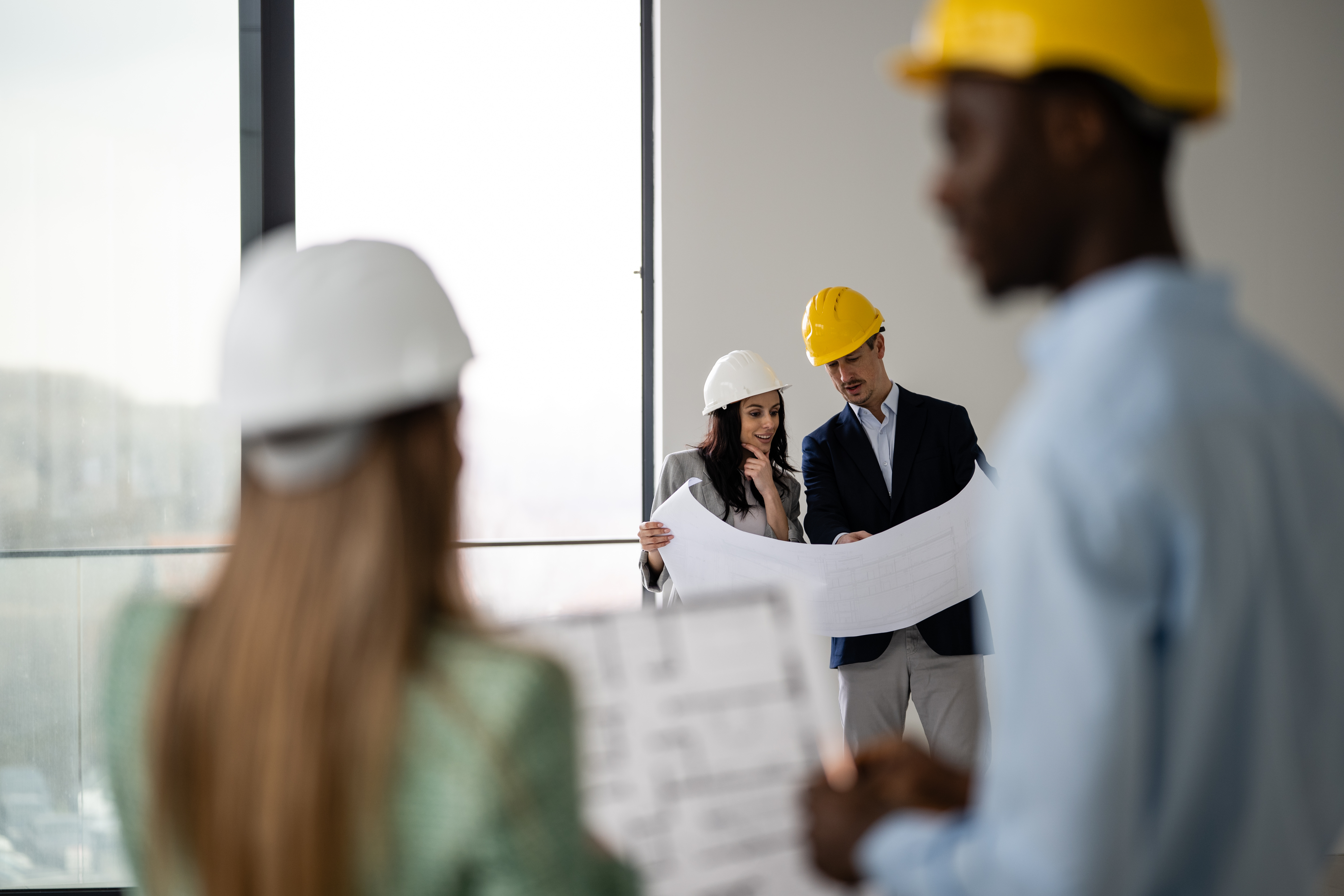 CRUX team on a site visit reviewing a space under construction