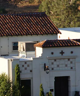 Red tile rooftops of Villa La Paz's white mission-style buildings