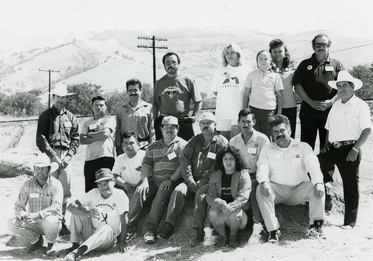 Historic black-and-white photo of United Farm Workers staff gathered outdoors at La Paz