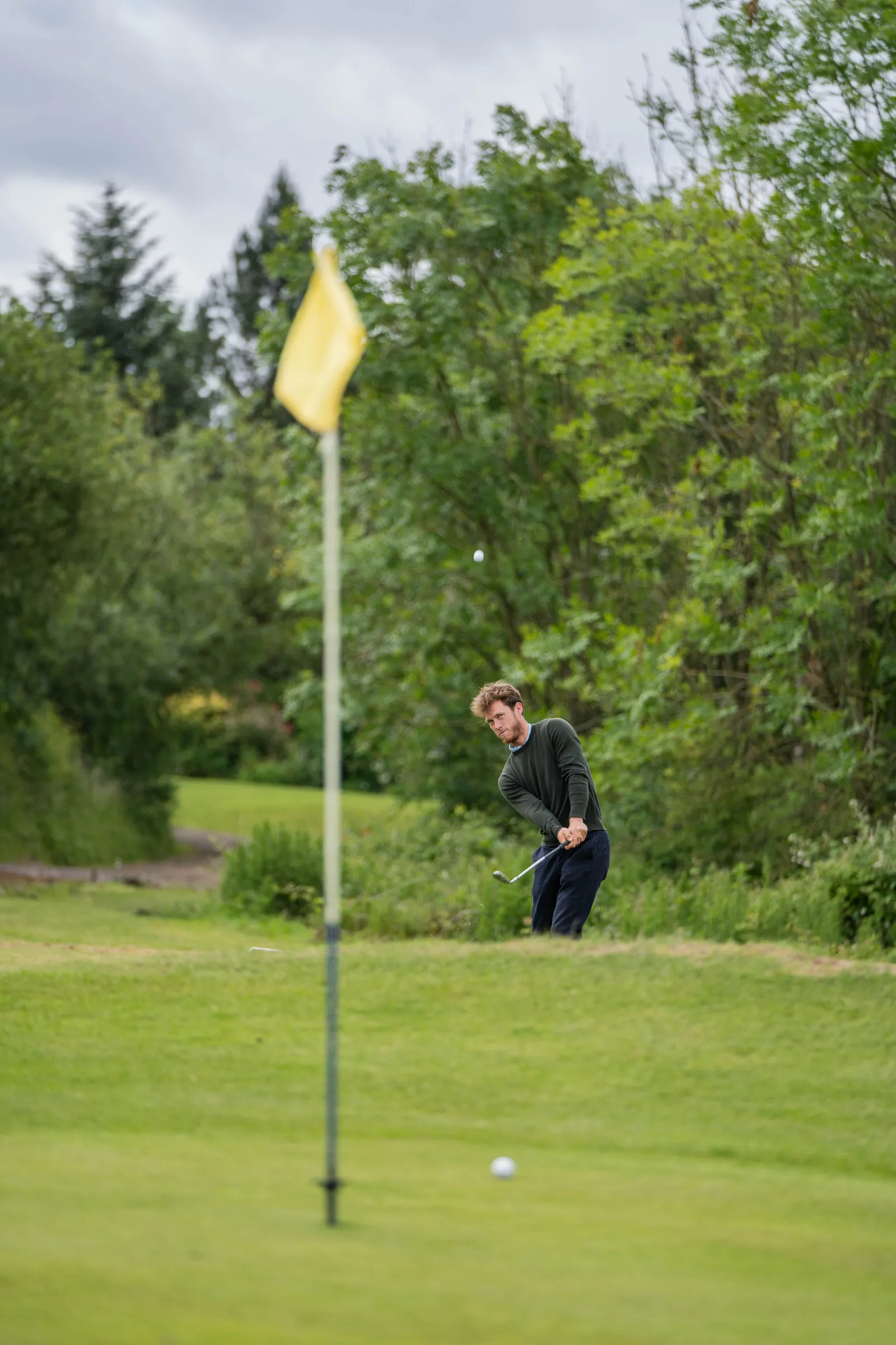 Putting practice on the practice green during a golf coaching session in Derbyshire