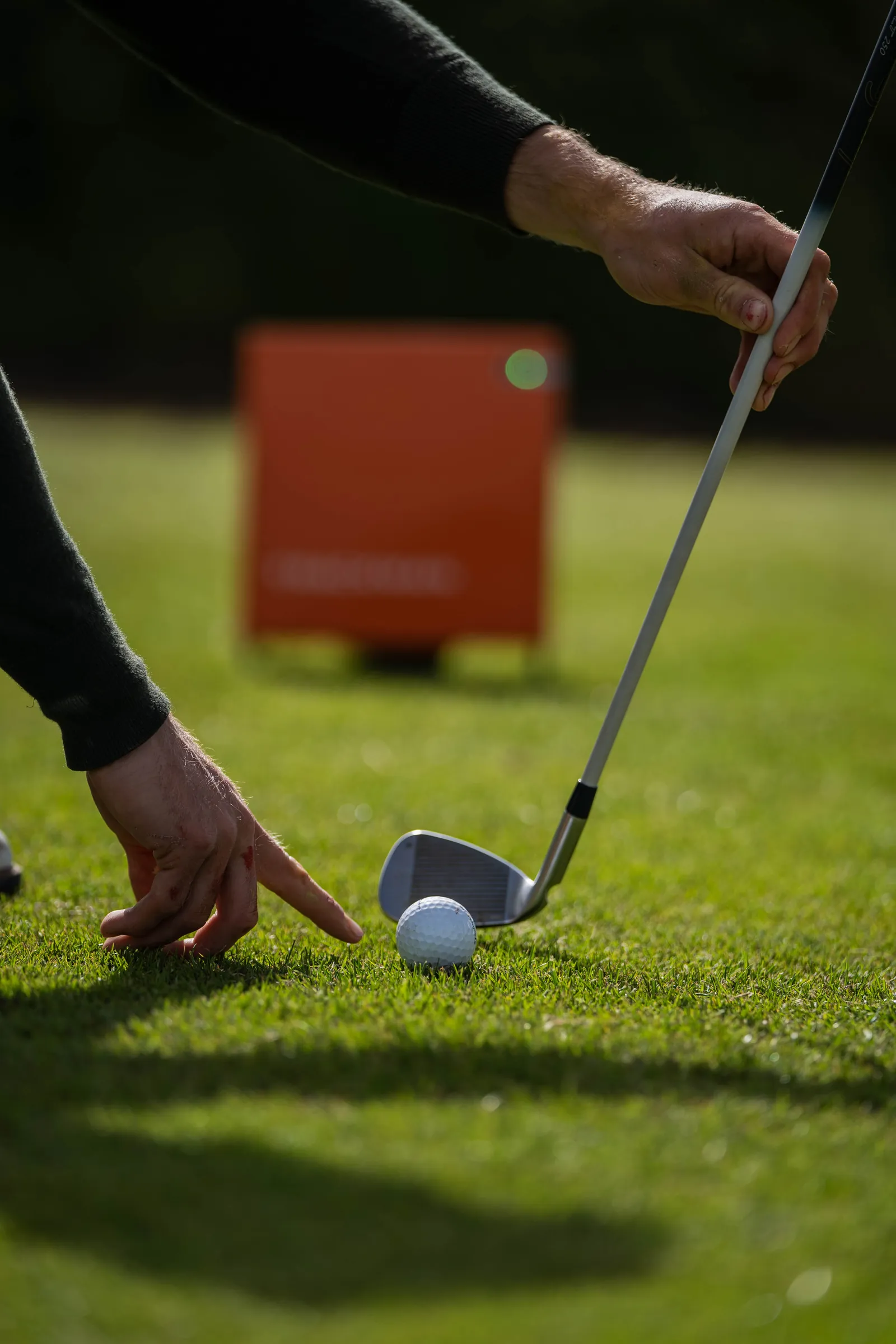 Close-up of a club face addressing the ball during a custom club fitting.