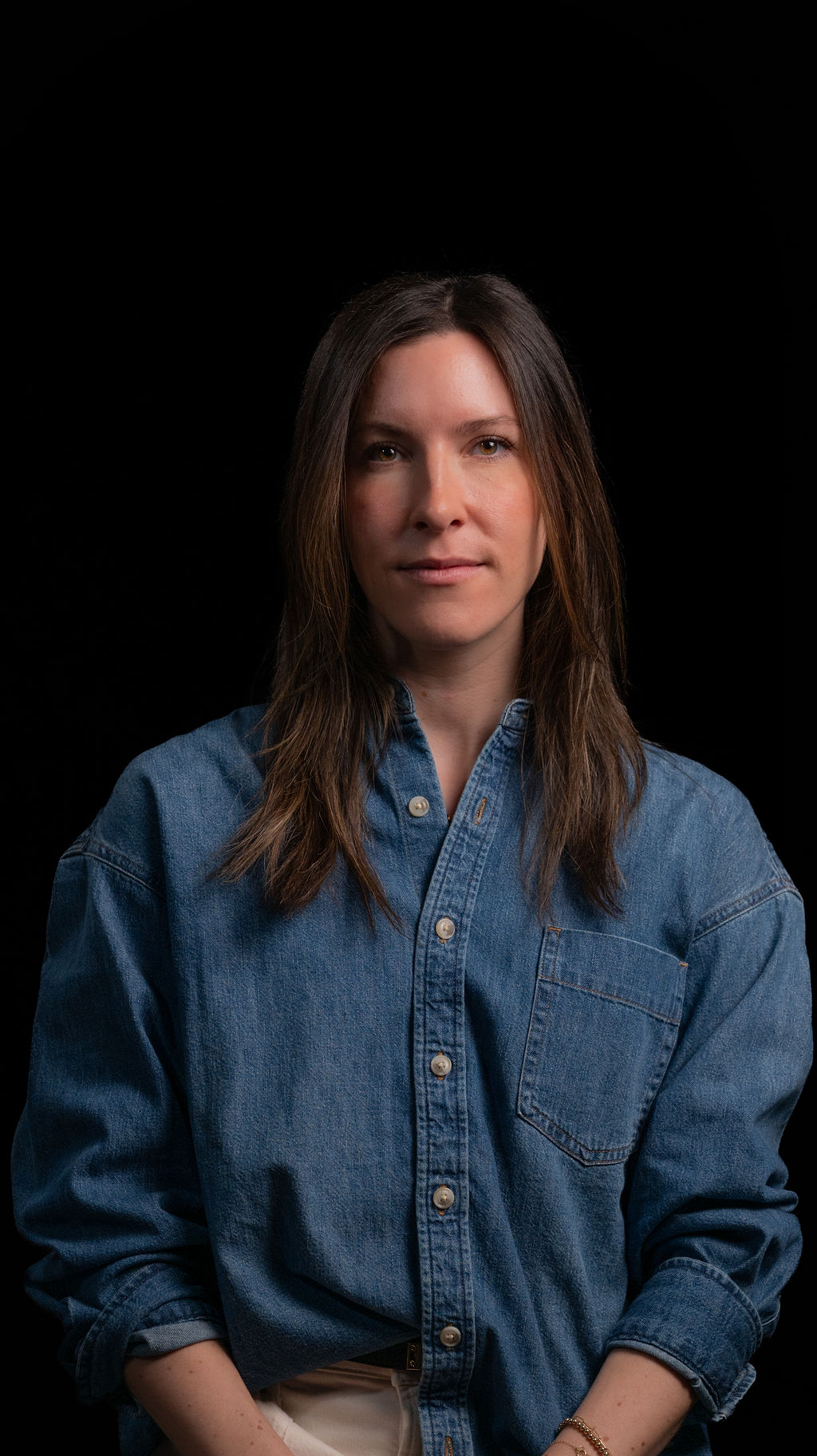 Bergen Telfer headshot on black background.