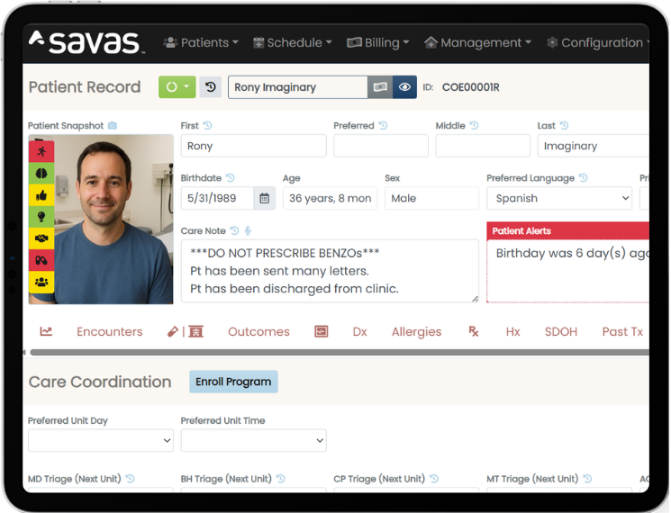 A laptop screen showing Savas Software's EHR system open to a patient record.
