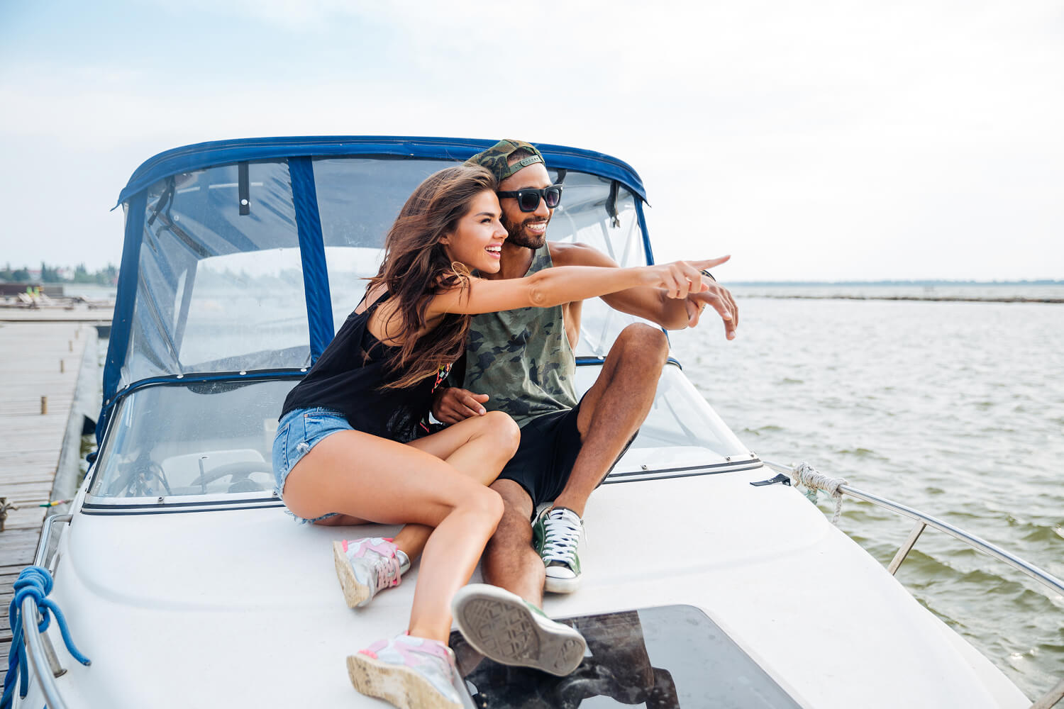 Smiling couple enjoying a boat ride together.