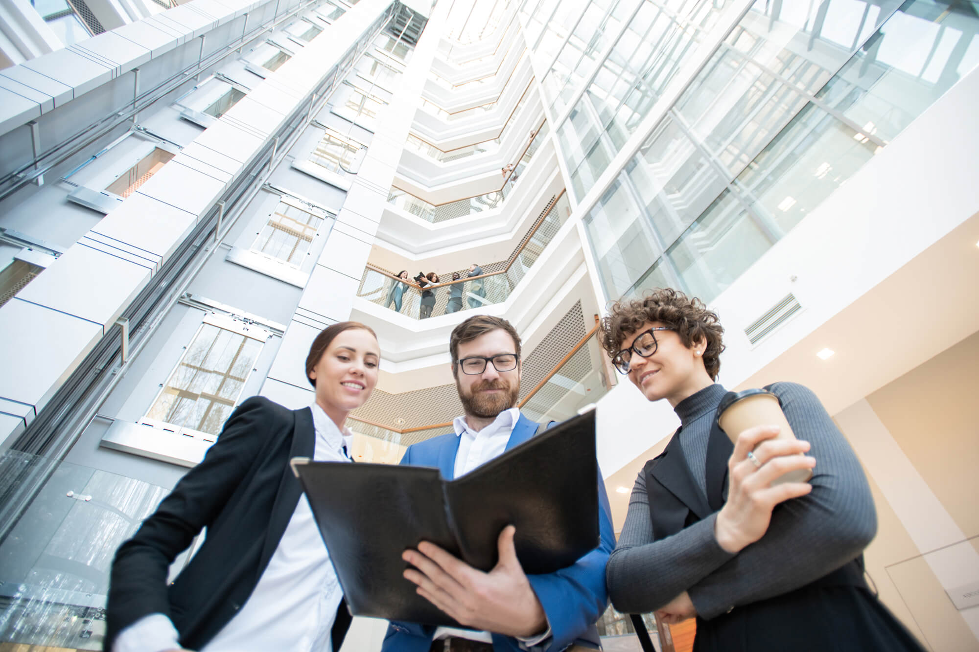 Business professional reading documents in an office.