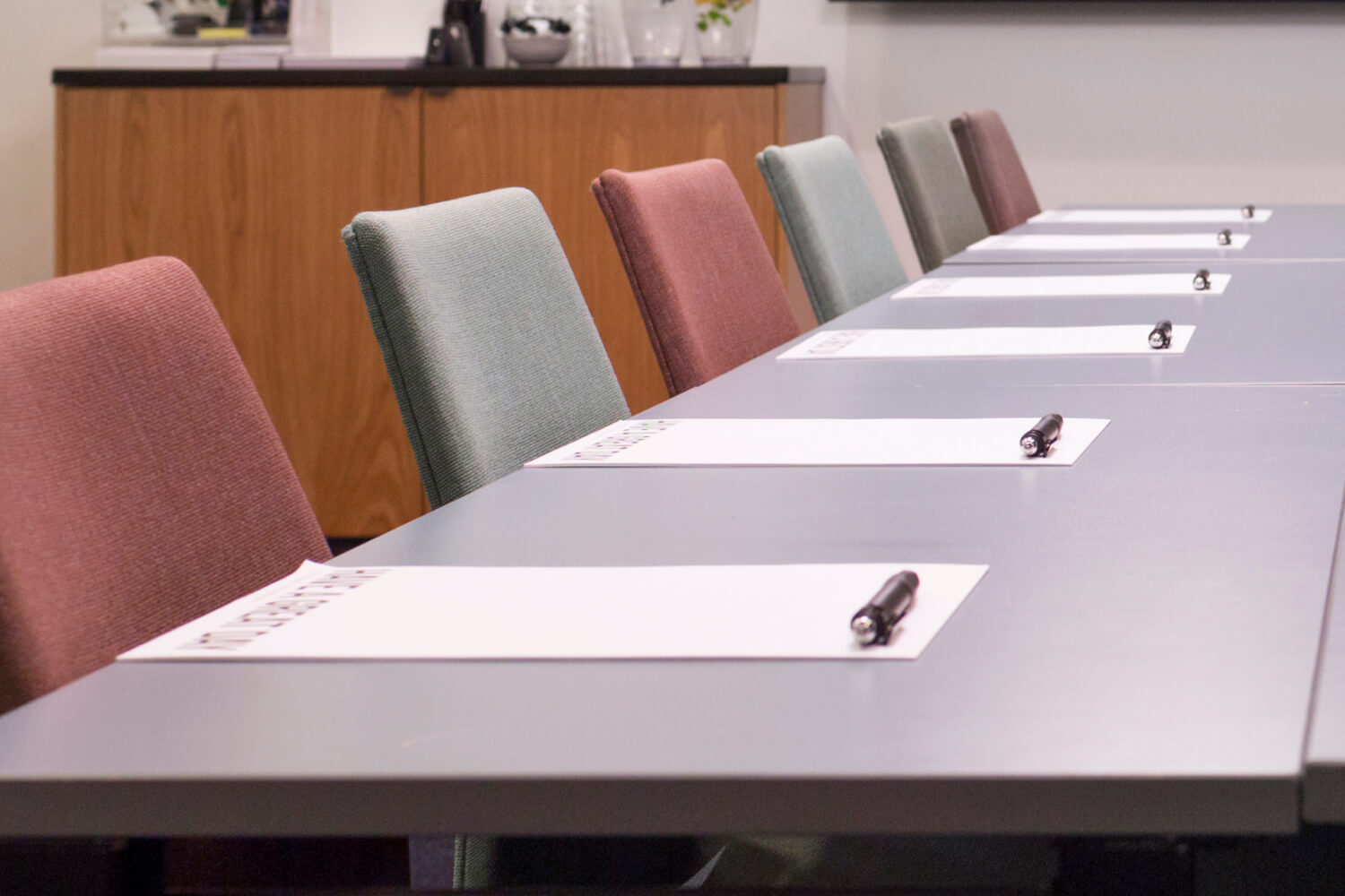 Modern conference room with a meeting table and chairs.