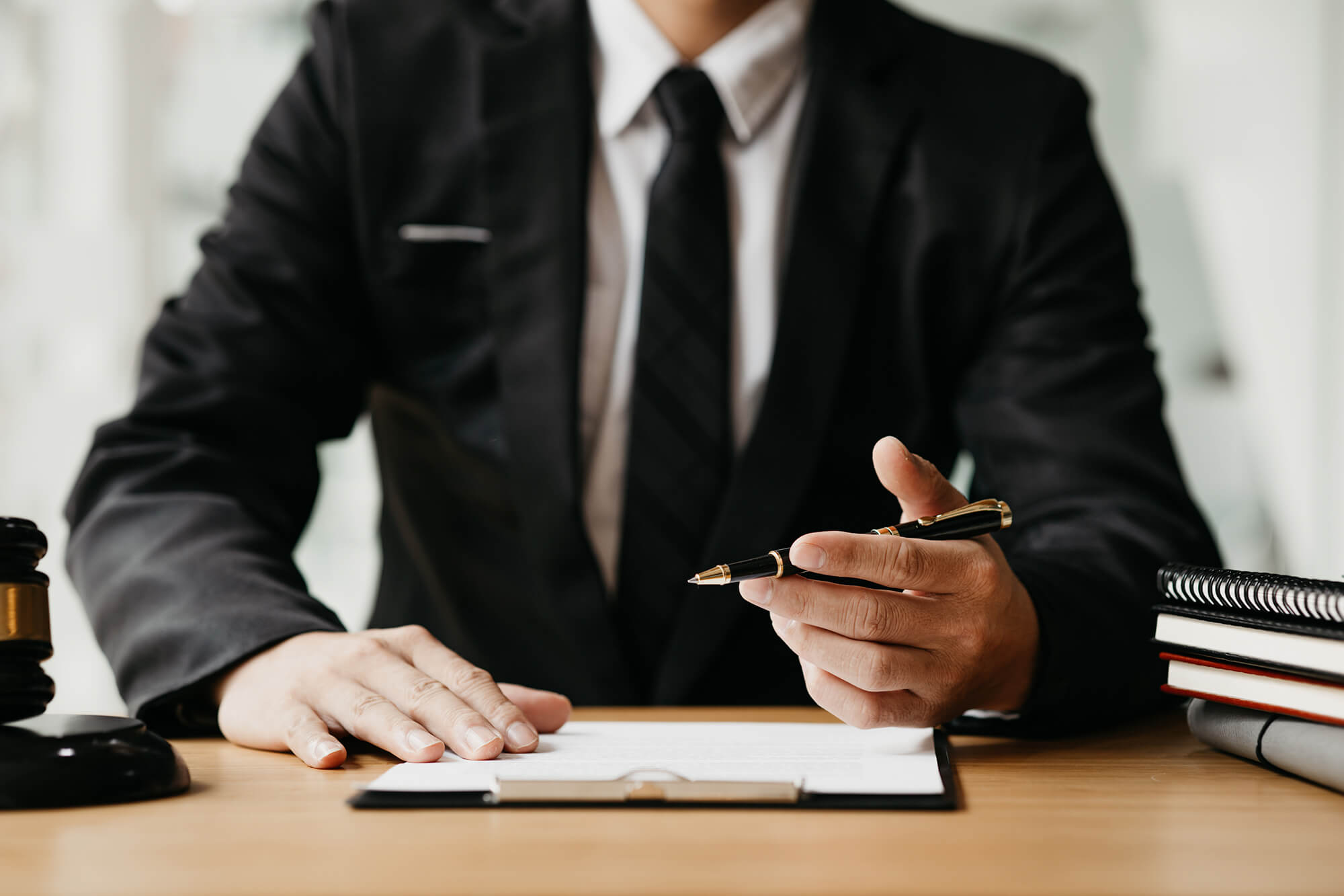 Lawyer sitting at a desk in an office.