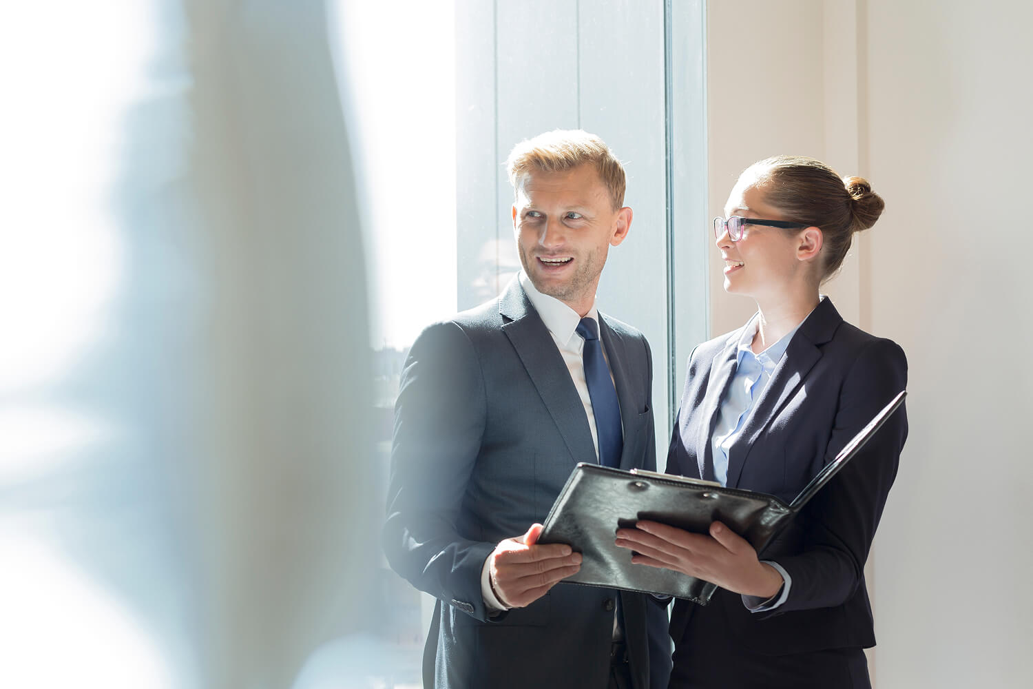 Business professionals reviewing documents together.