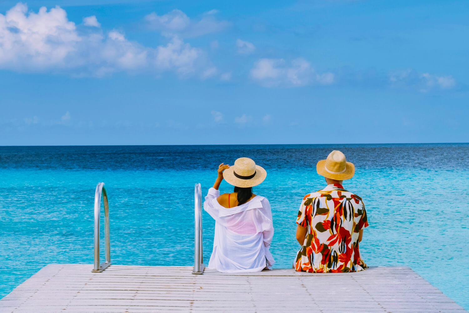 Couple relaxing on a tropical beach in Curaçao.