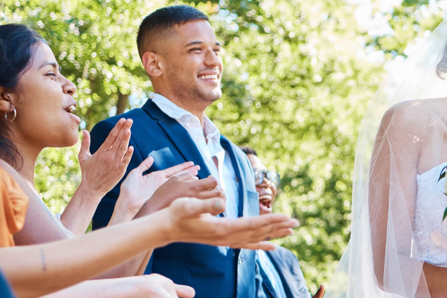 Wedding guests celebrating at a wedding.
