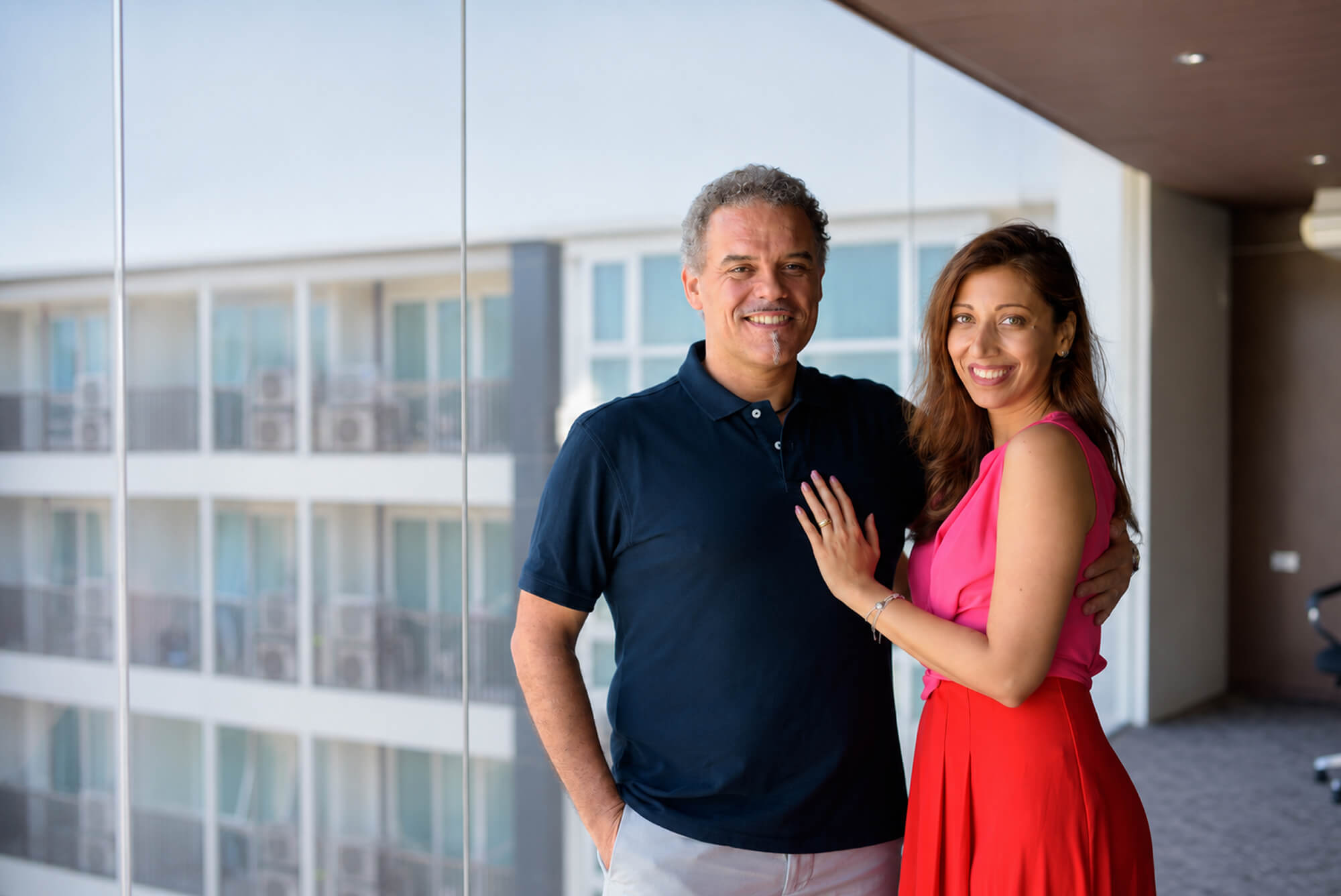 Happy couple embracing in an urban setting.