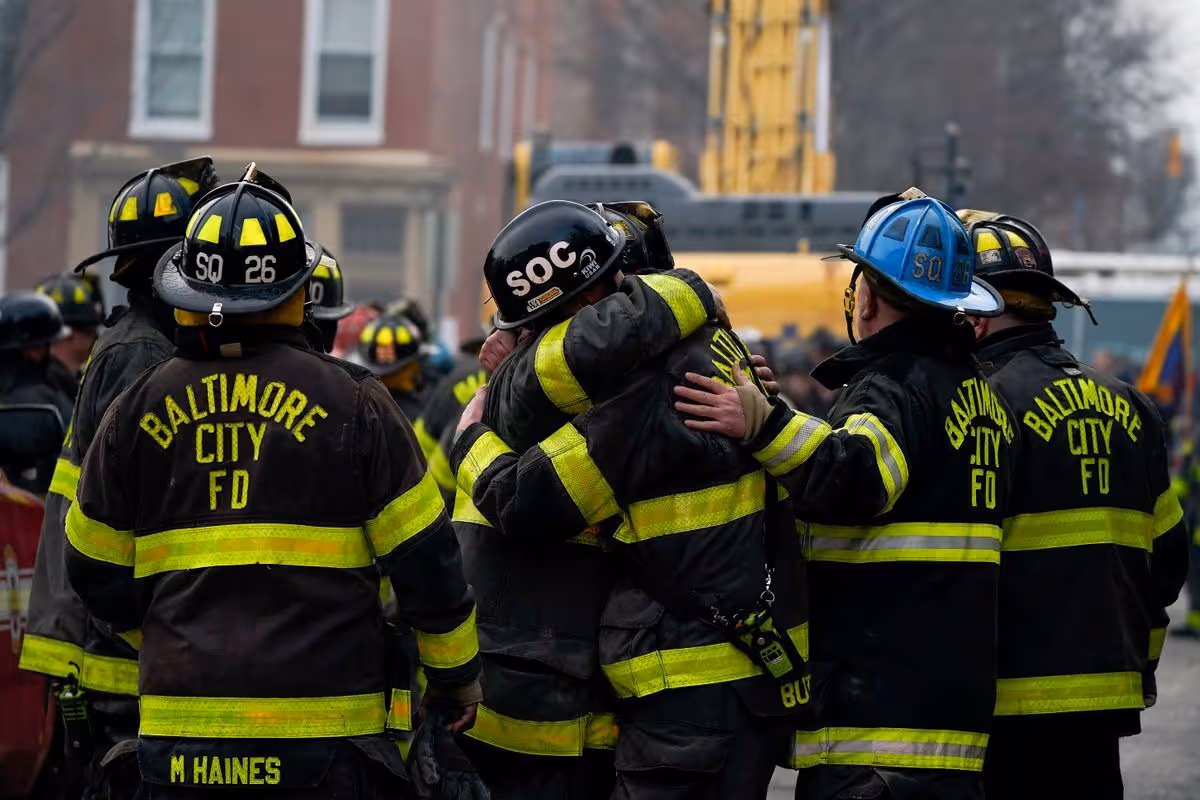 Firefighters hug