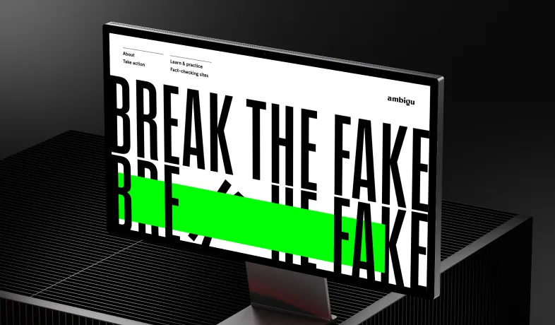 Computer monitor displaying the text 'BREAK THE FAKE' with a bright green horizontal stripe.