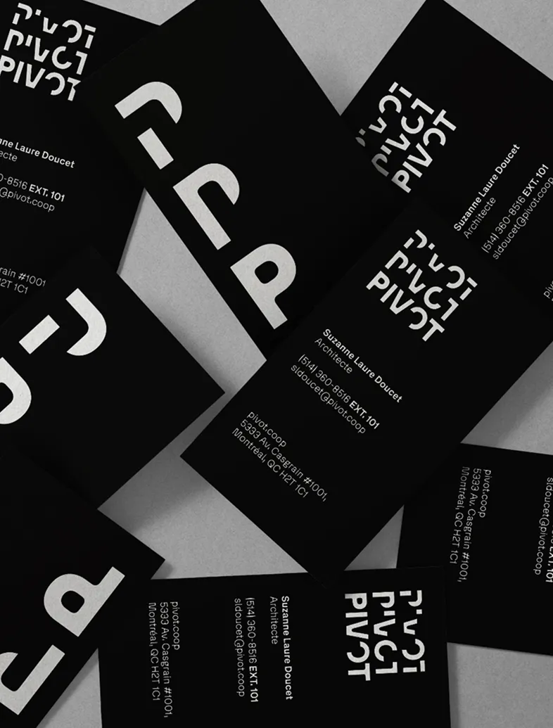 Black business cards for architect Suzanne Laure Doucet with white Pivot logo and contact details.