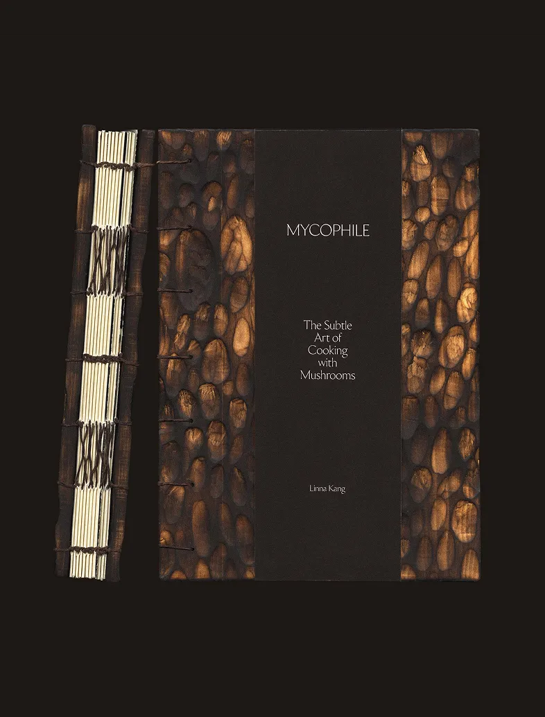 Book titled Mycophile The Subtle Art of Cooking with Mushrooms by Linna Kang with a textured brown cover.