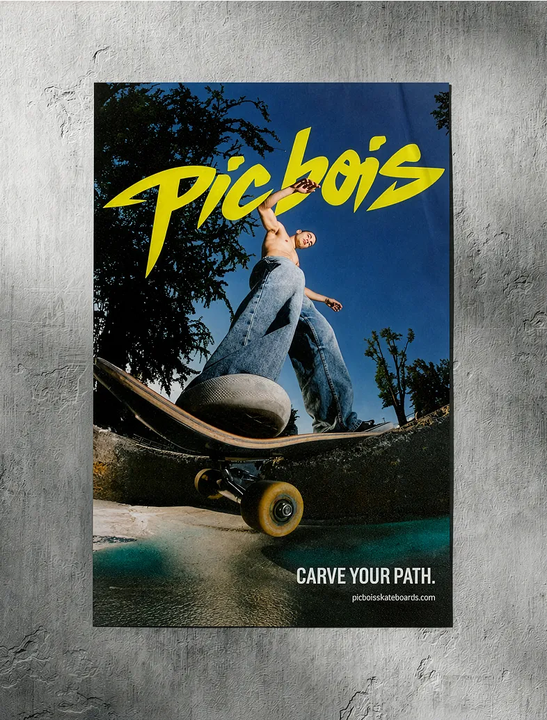 Skateboarder carving on board under bright blue sky with yellow Picbois logo and 'Carve Your Path' text.