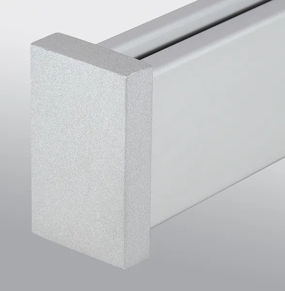 Close-up of a silver aluminum extrusion profile with a rectangular end cap.