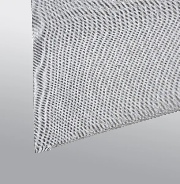 Close-up of a white mesh fabric with a grid-like pattern on a gray background.