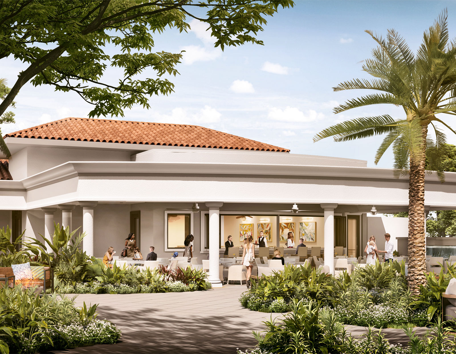 Outdoor seating area of a Mediterranean-style building with a terracotta tiled roof, white columns, and lush green landscaping with palm trees and a variety of plants, with several people socializing and relaxing on patio furniture under a covered area.