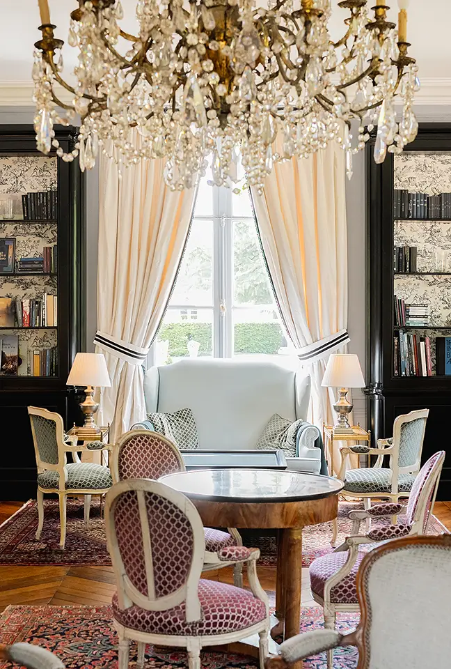 Close-up view of the elegant seating area with pink medallion chairs, showcased by "Les Hauts de Loire – Hotel, Restaurant & Spa – 5-star".
