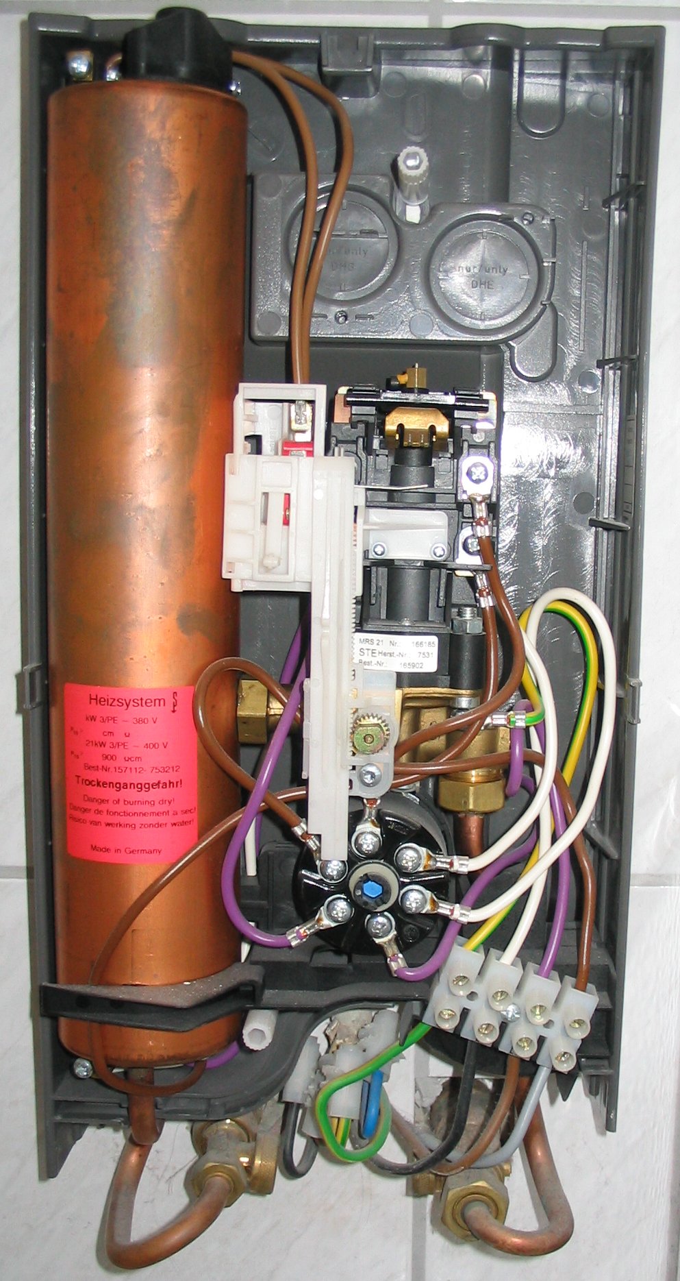 Tankless water heater unit and connections by Strategic Heating & Air in Halifax, VA