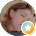 Face of a woman applying foundation makeup with a beauty blender sponge.