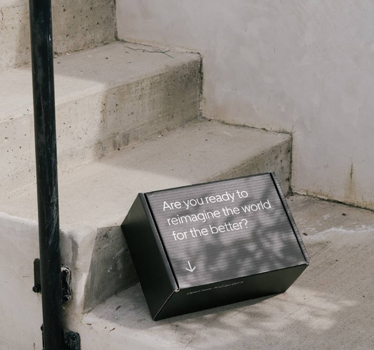 Uber custom black mailer box with “reimagine the world for the better” messaging