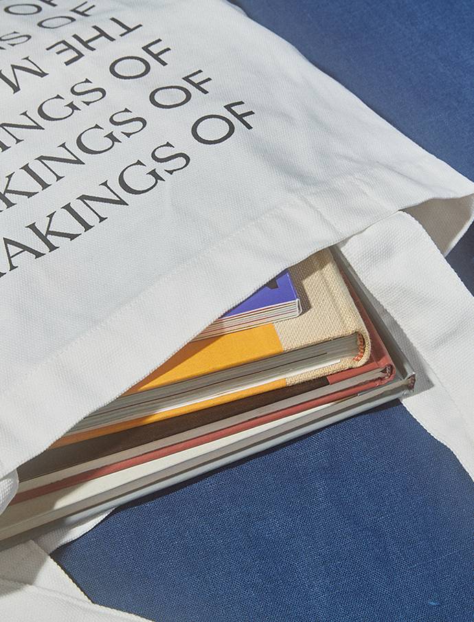Google custom tote bag filled with notebooks and branded materials