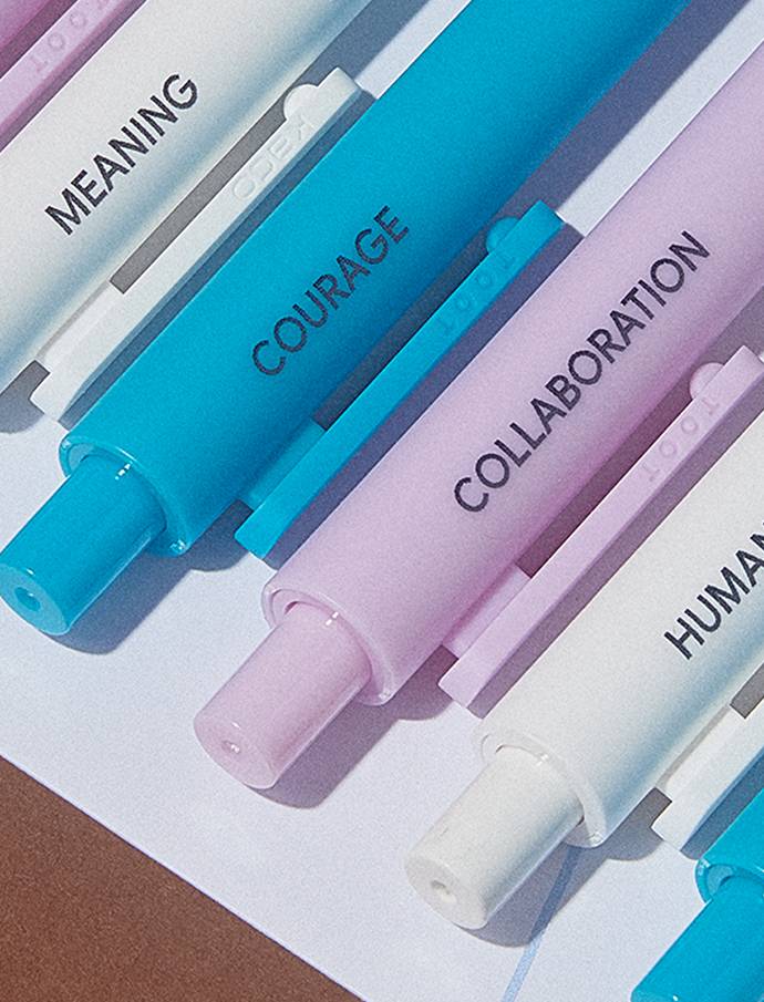 Close-up of Google custom pastel pens printed with company values