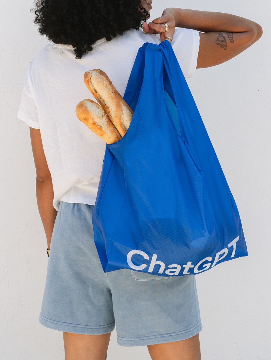 ChatGPT custom blue tote bag carrying baguettes