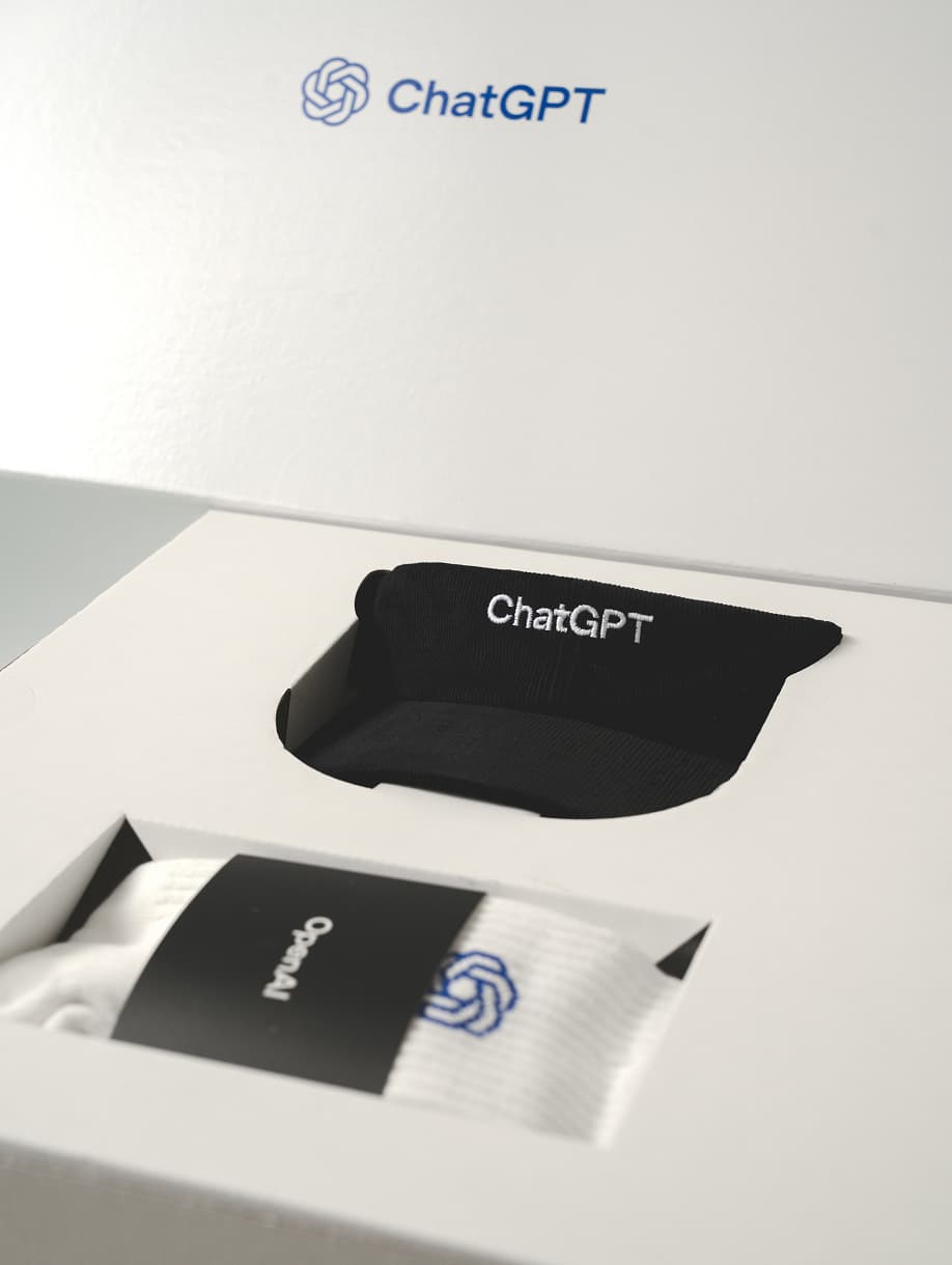 ChatGPT custom black visor and branded socks in gift box