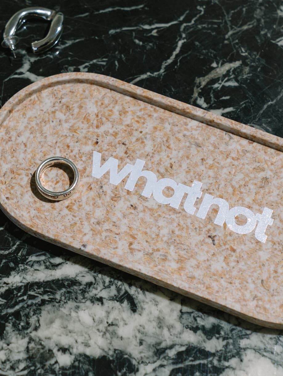Whatnot custom branded pouch with white logo