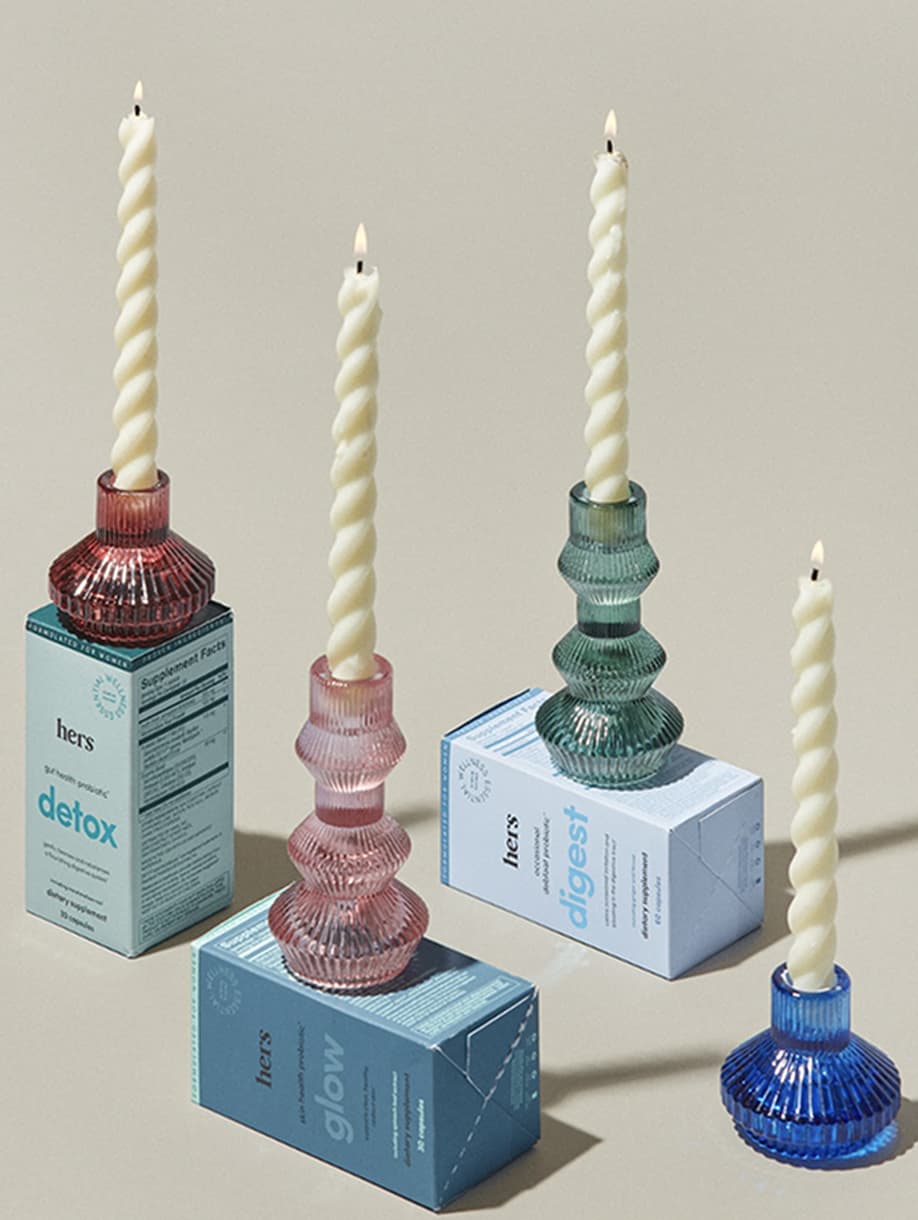 Hers custom glass candleholders with wellness product boxes