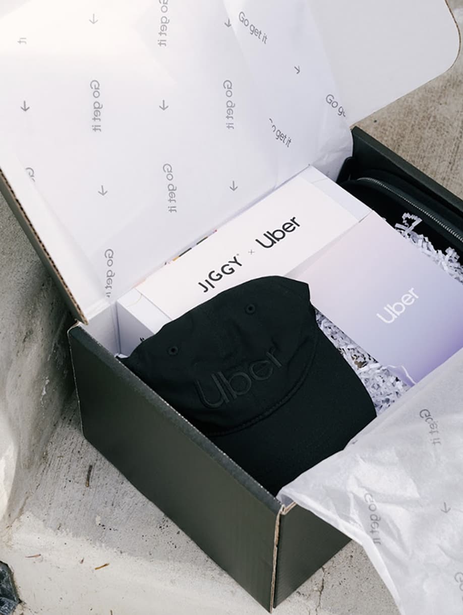 Uber custom gift box with JIGGY puzzle and black embroidered cap