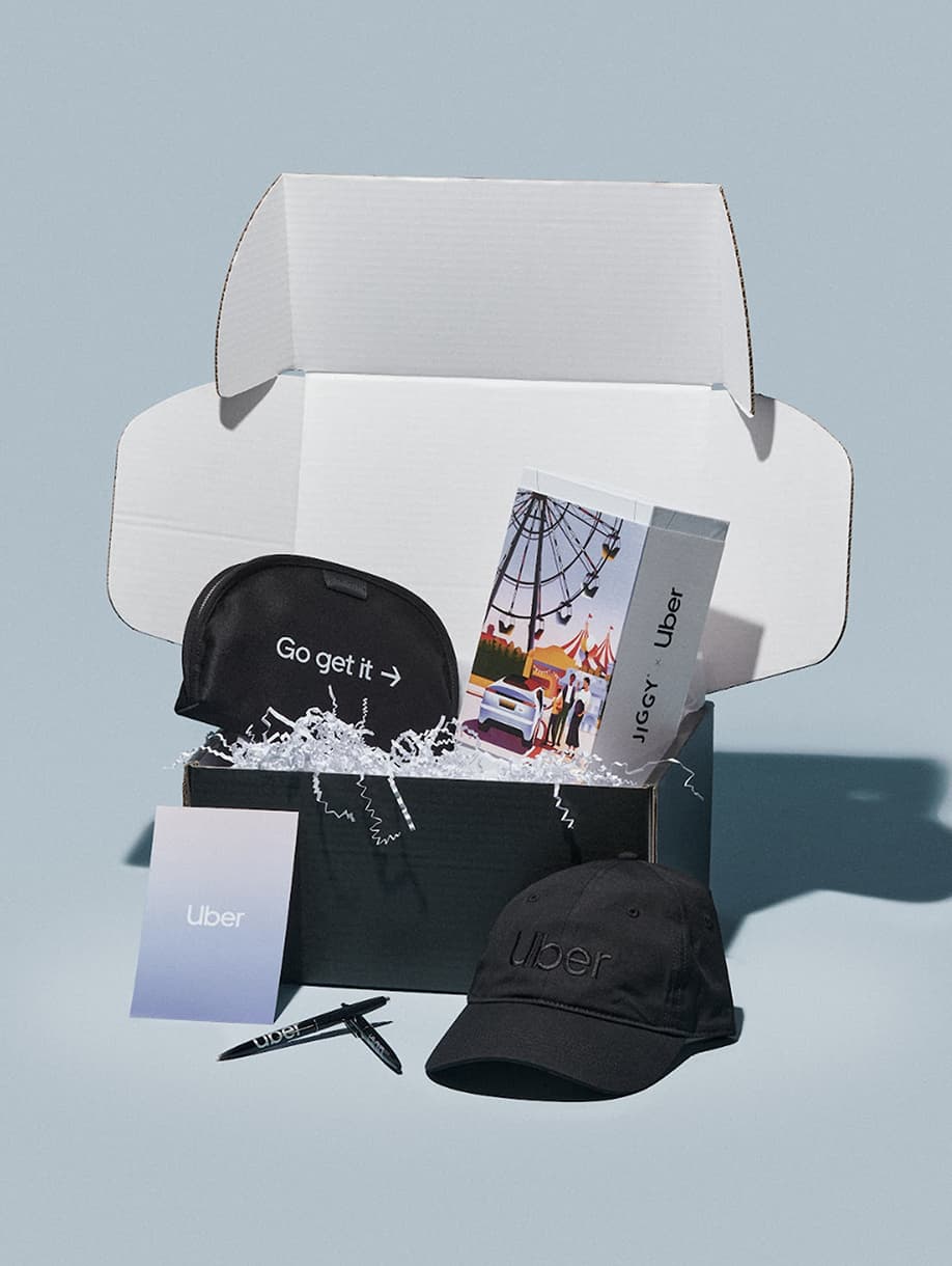 Uber custom gift box with JIGGY puzzle, black cap, pouch, and pen