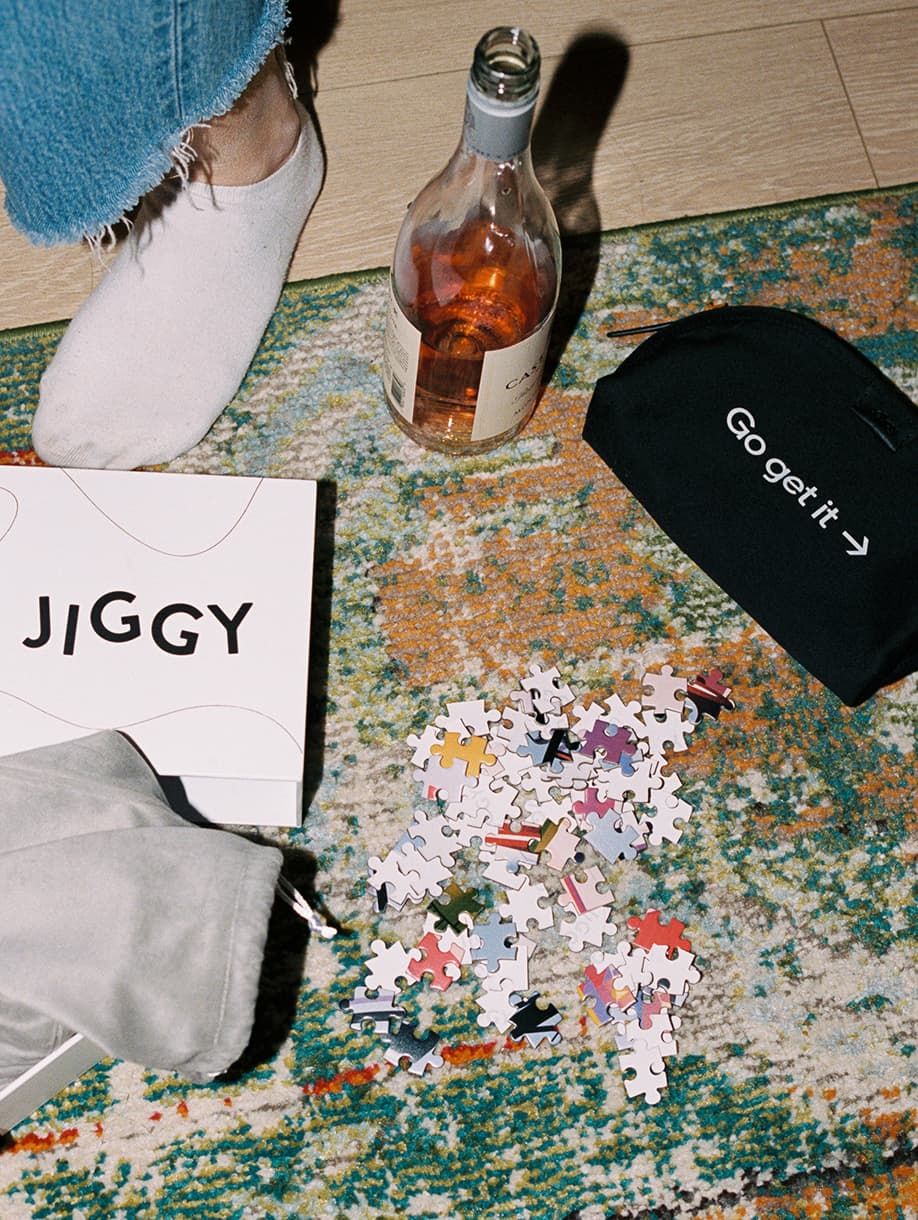 JIGGY x Uber custom puzzle with black “Go get it” pouch and branded packaging