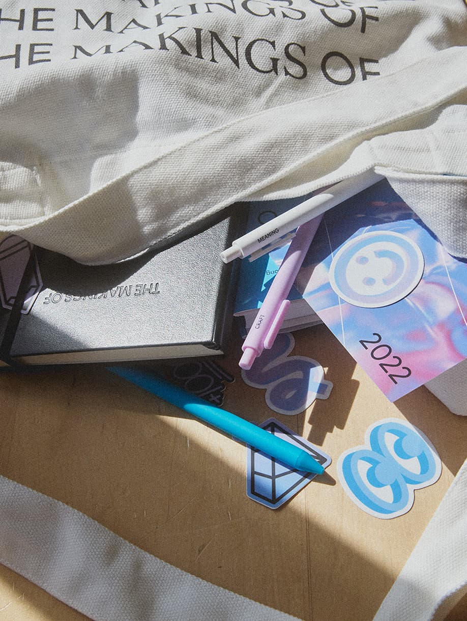 Google custom merch kit with tote bag, notebook, pens, stickers, and “The Makings Of 2022” booklet
