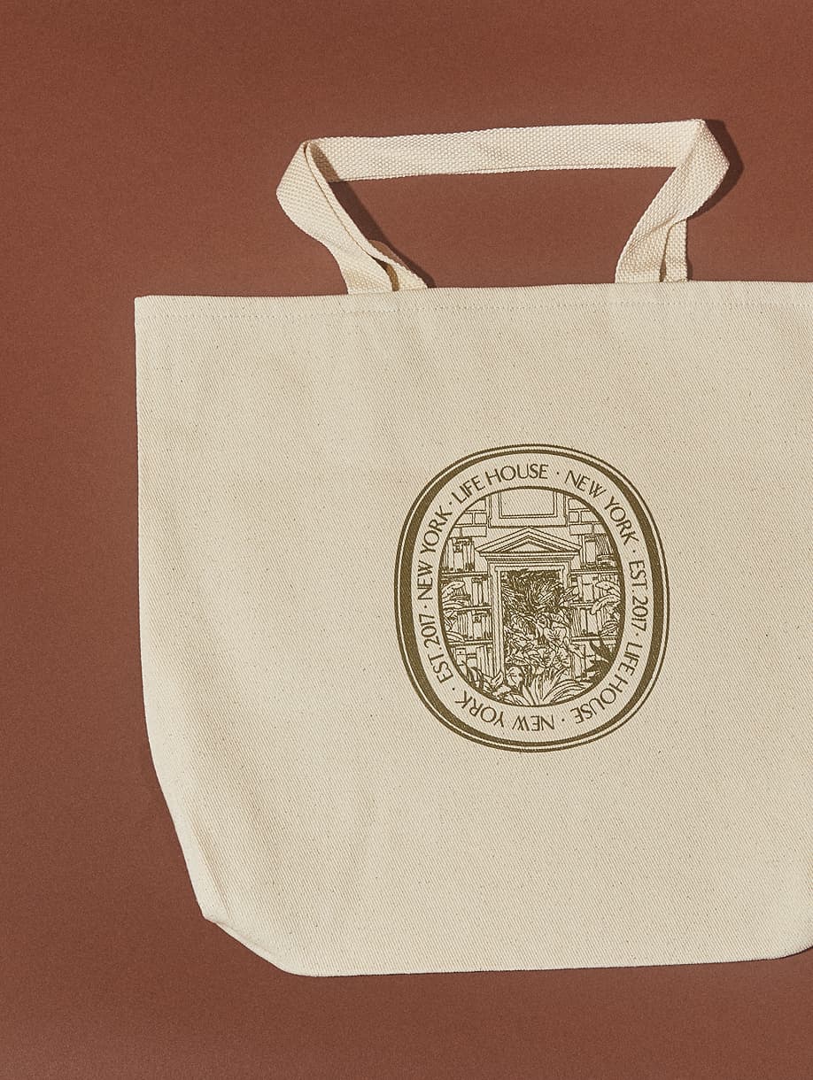 Life House custom canvas tote bag with illustrated New York seal