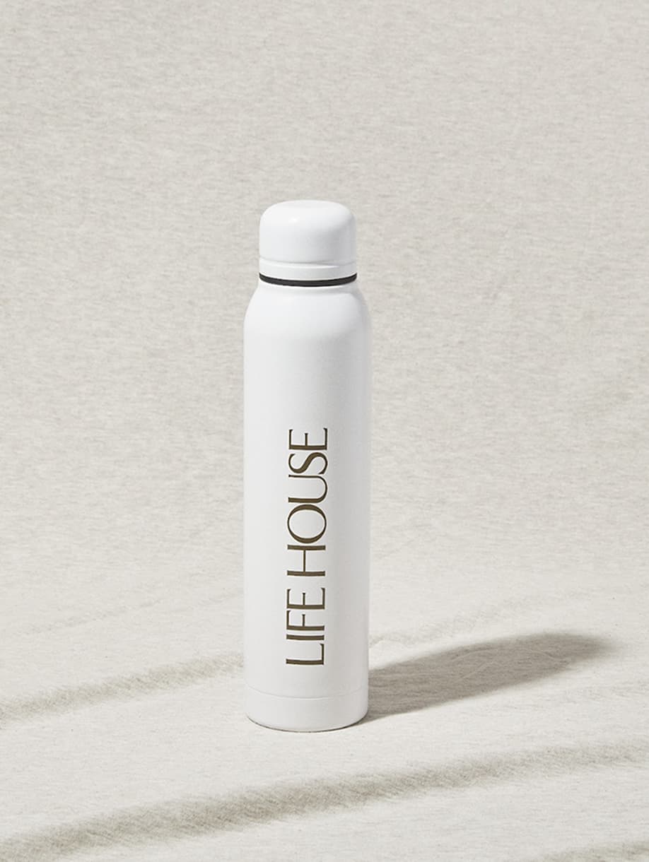 Life House custom white water bottle with gold logo