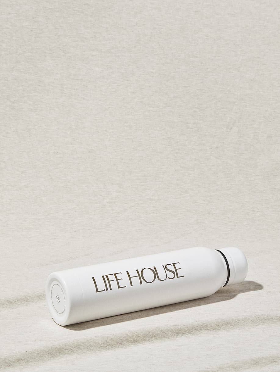 Life House custom white water bottle with gold logo