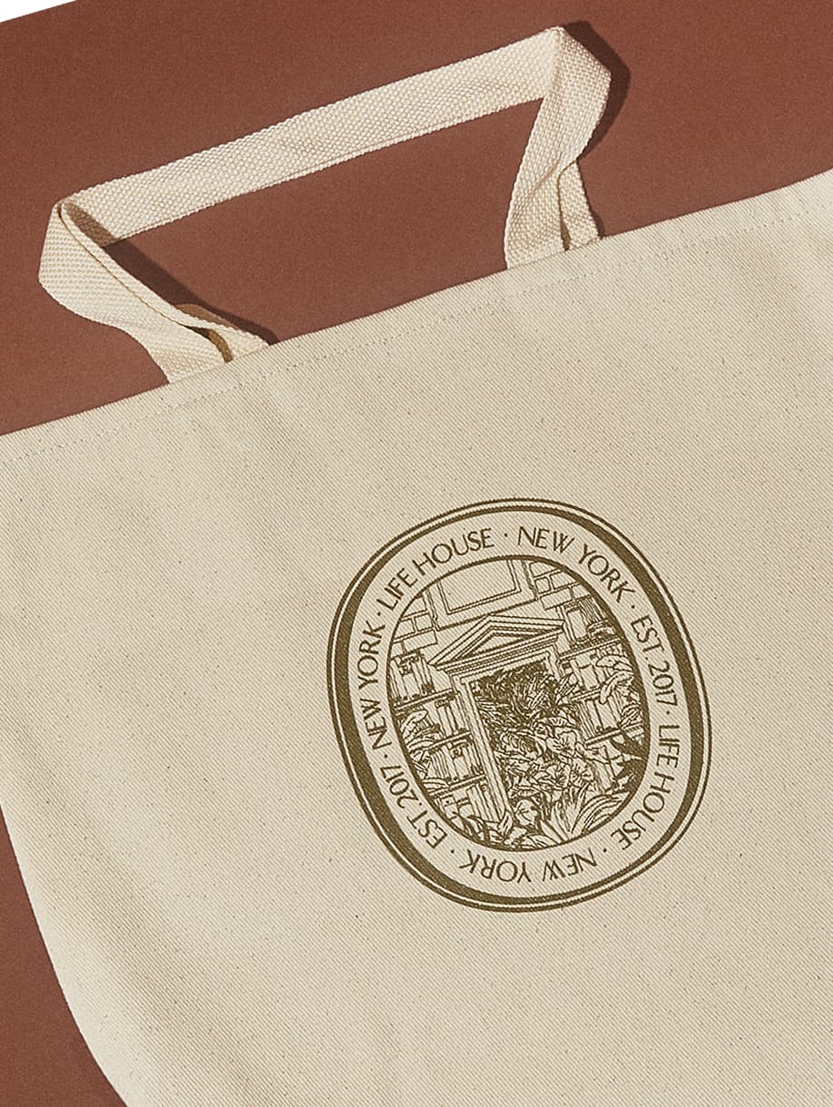 Life House custom canvas tote bag with illustrated New York seal