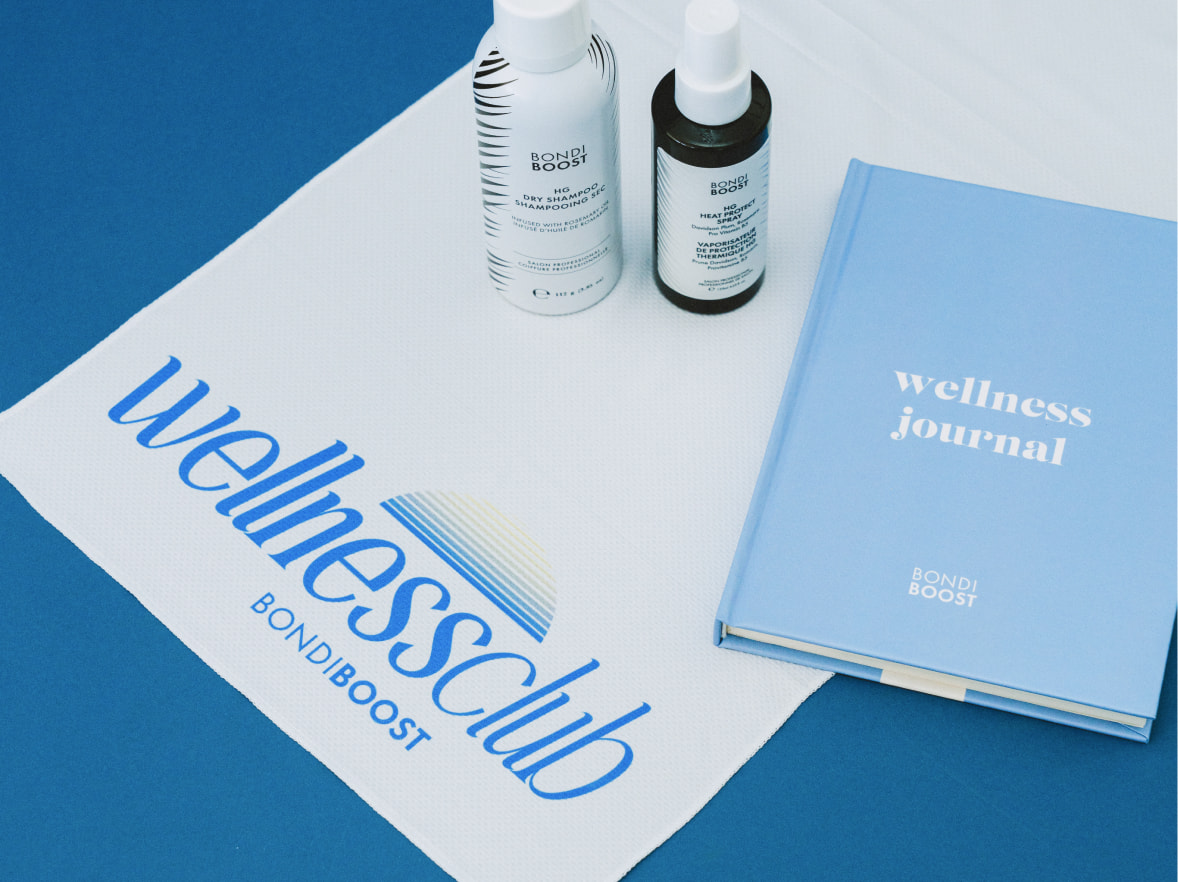 Custom Bondi Boost blue wellness journal book next to products