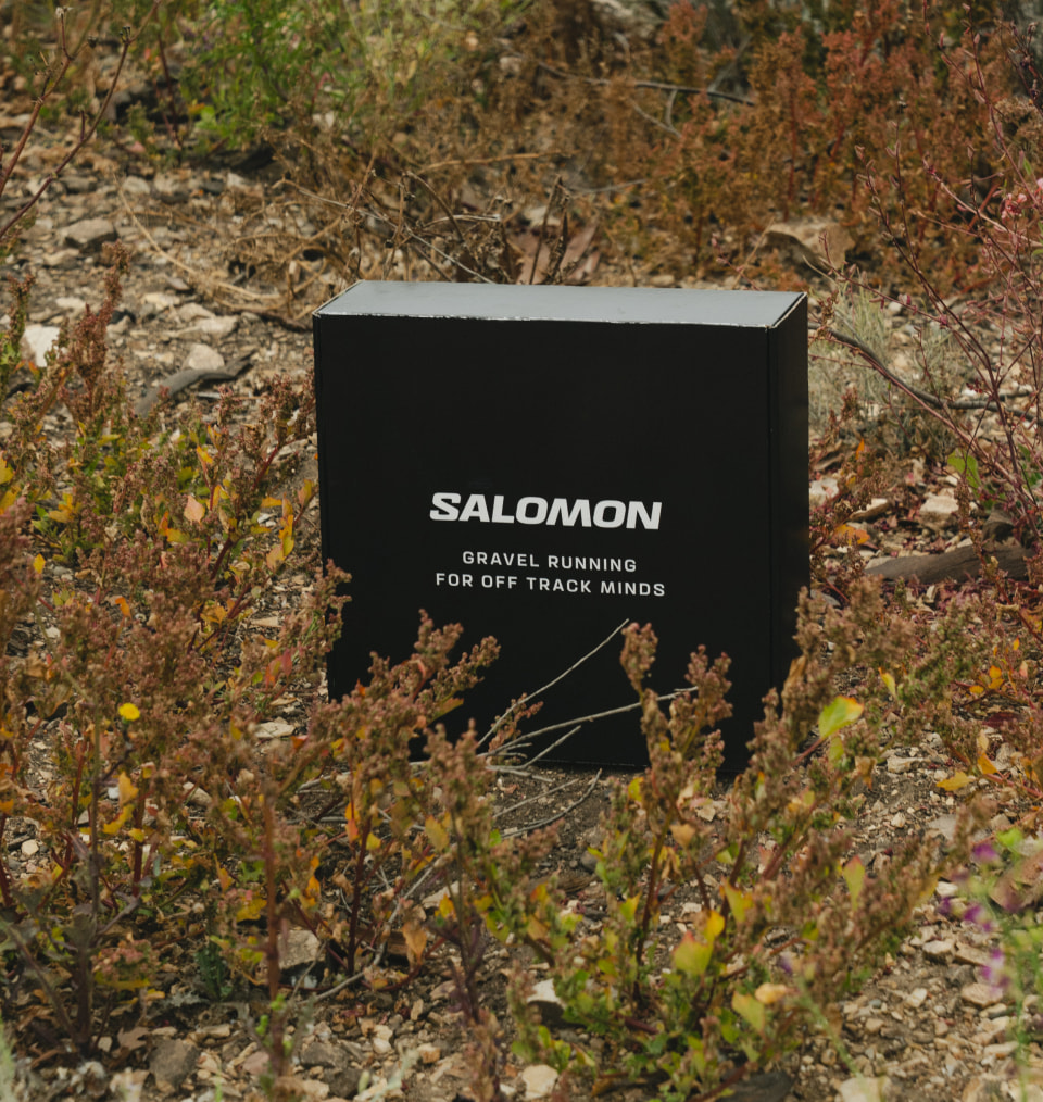 Black Salomon branded gift box displayed outdoors